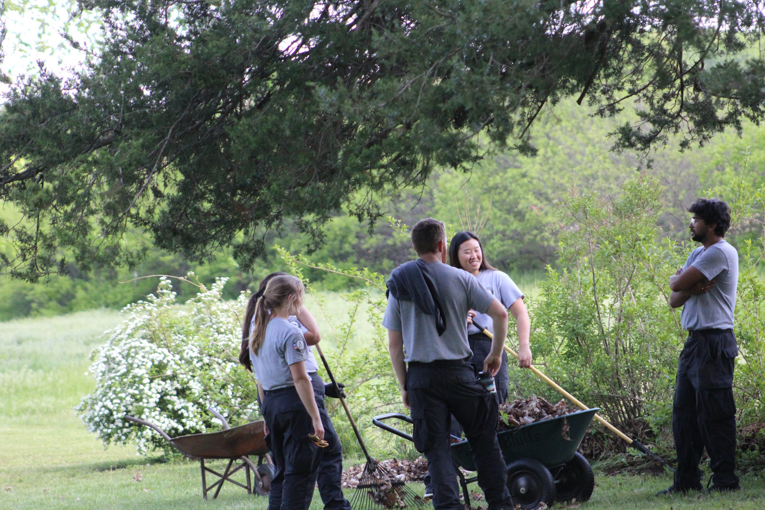 Volunteers vising outdoors during chores