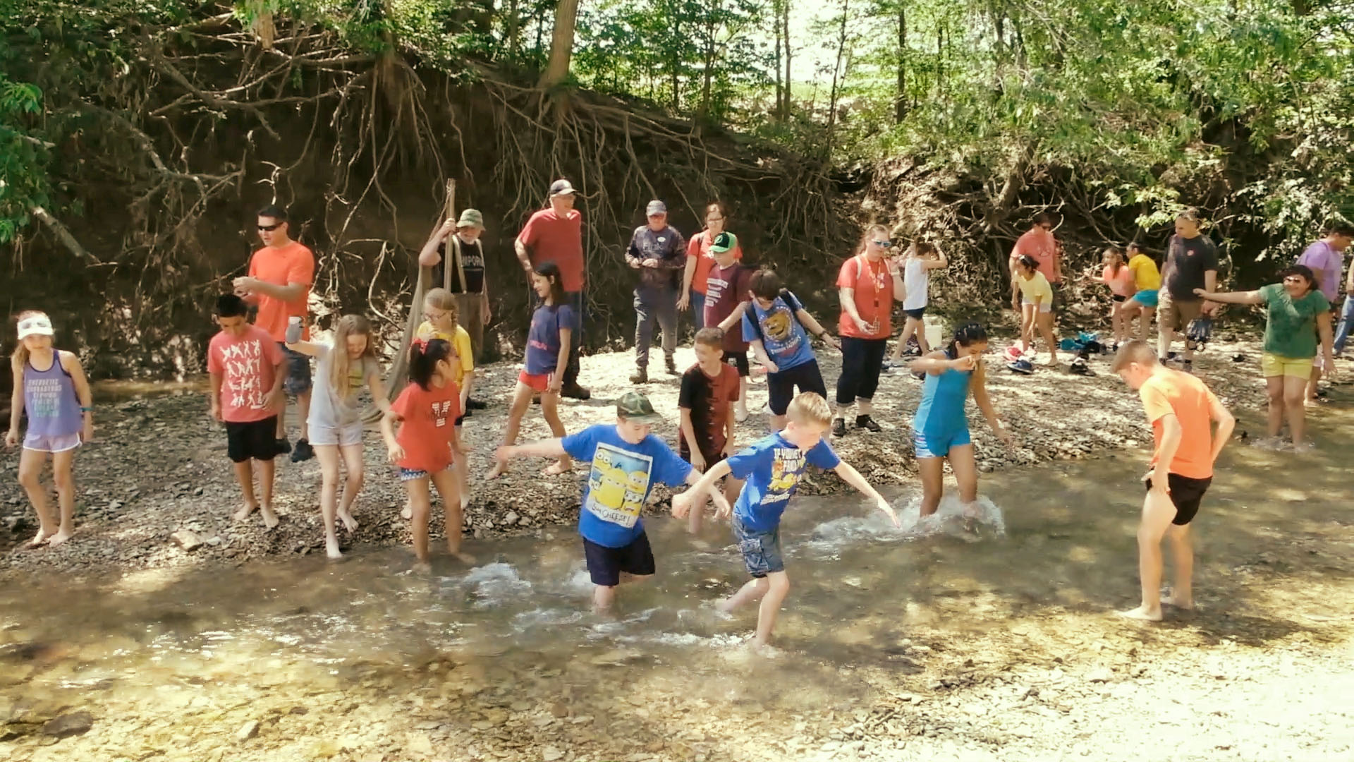 Children playing in a stream